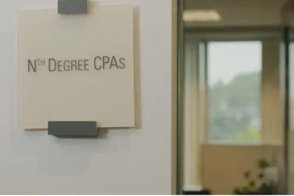A sign on a wall that says nth degree cpas