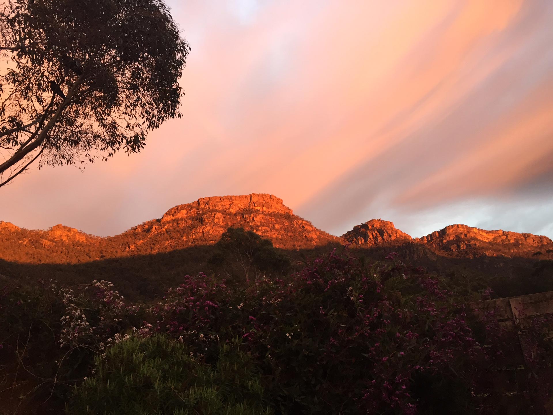 Halls Gap Valley Lodges view of sunrise showing moutains of the Serra Range including The Pinnacle lookout (middle hump).