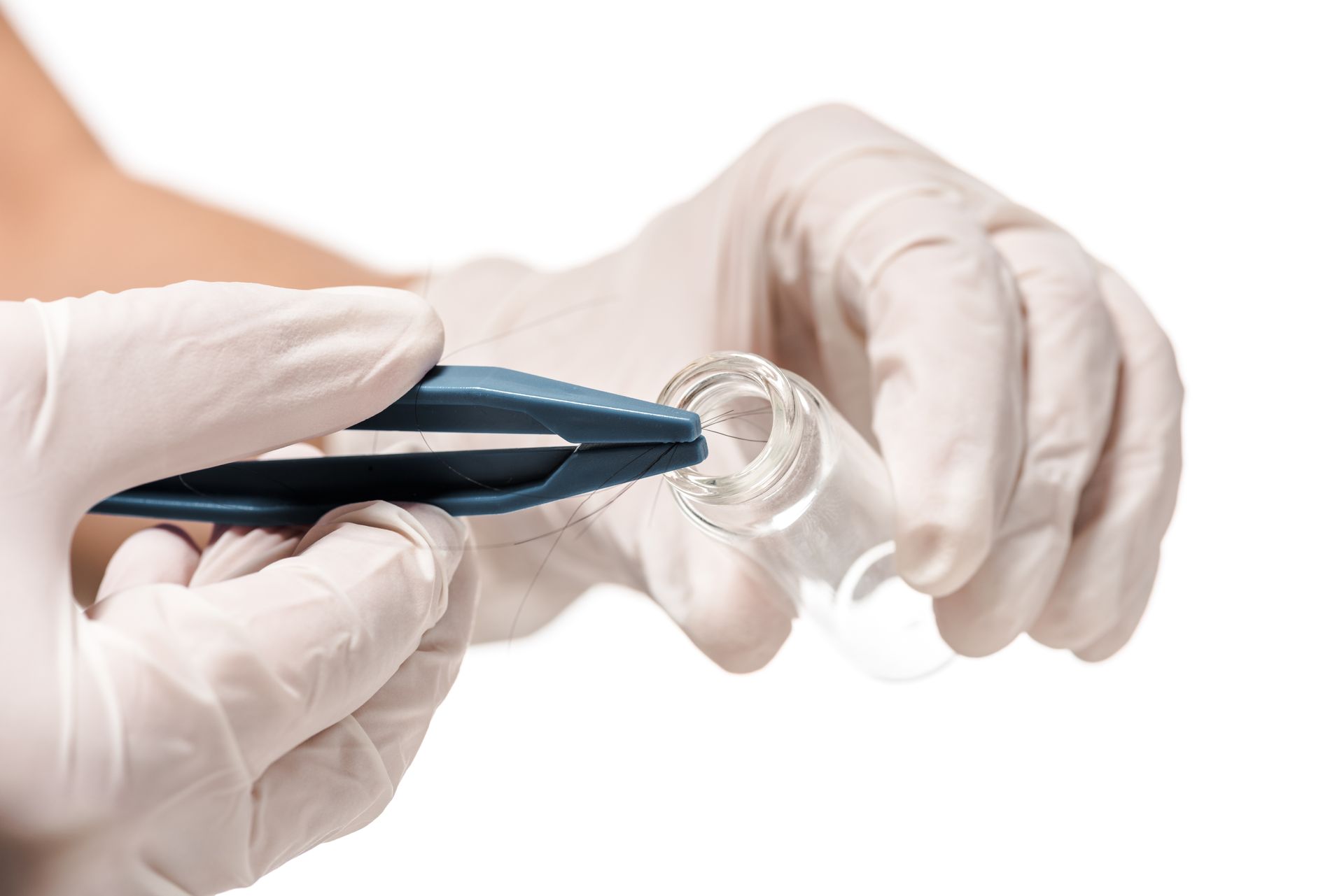 Hands in white gloves using tweezers to place something into a small glass vial.