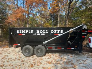 A dumpster that says simply roll offs on it