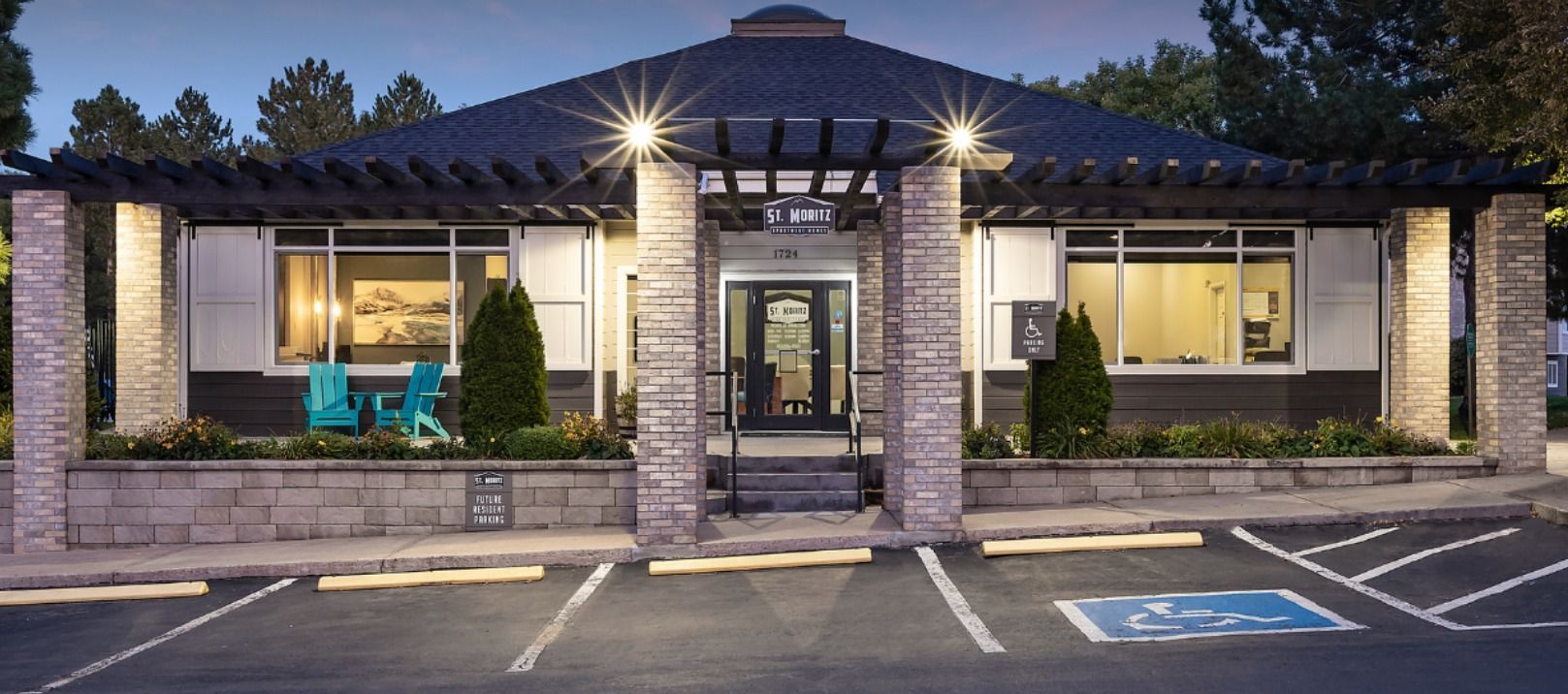 A large building with a parking lot in front of it.