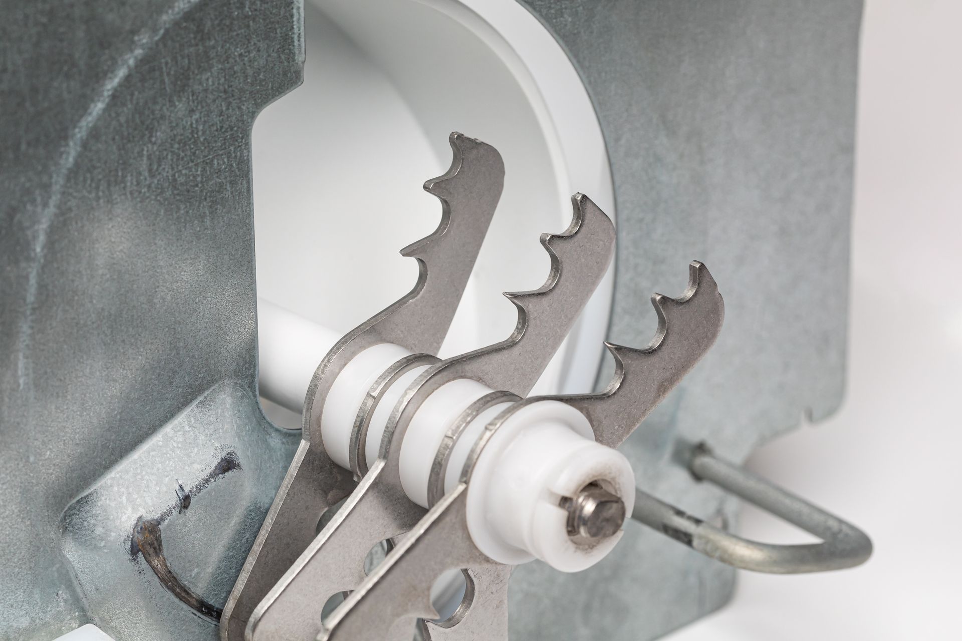 Crushed ice maker blades in refrigerator ice machine.