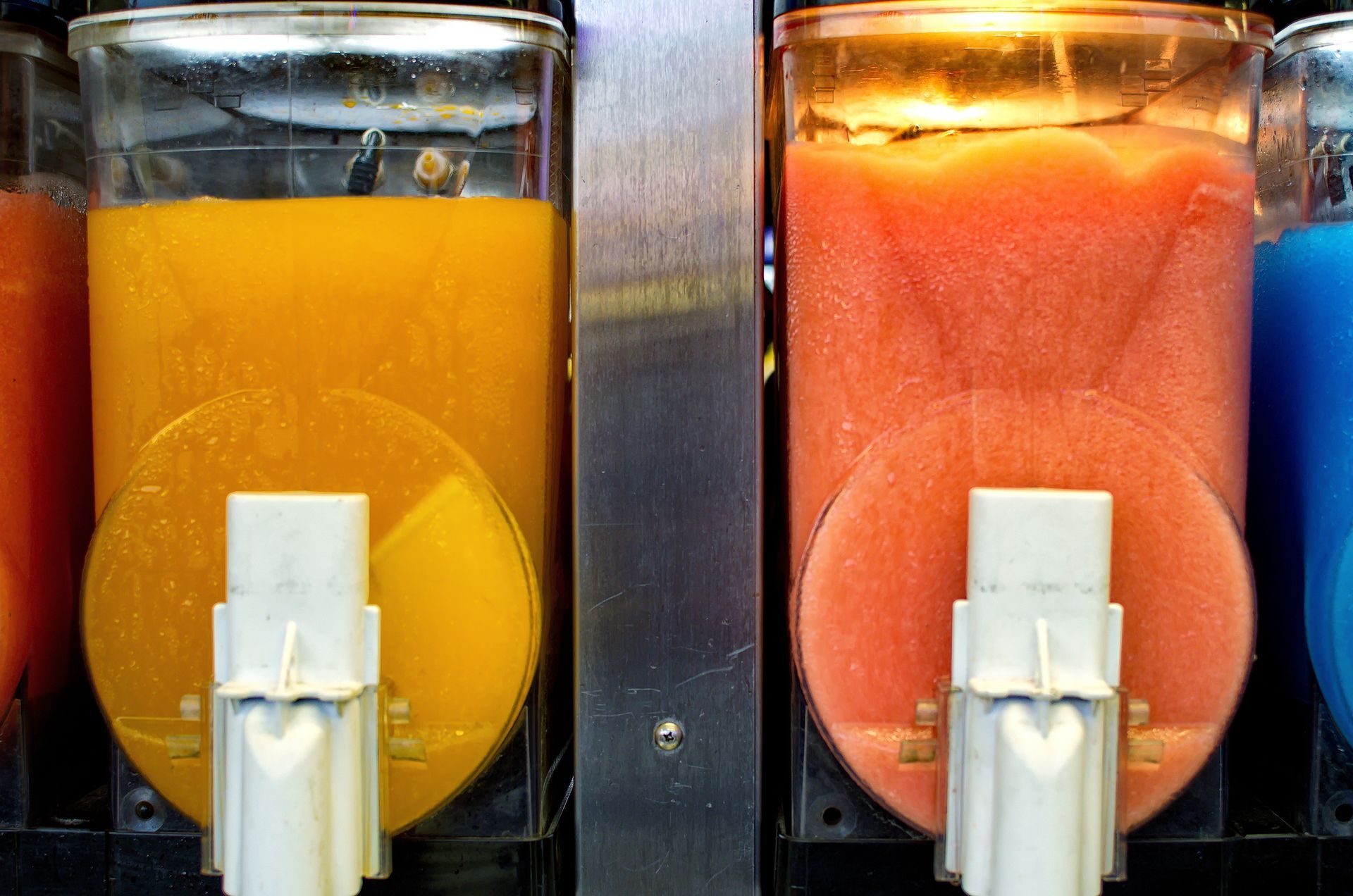 Frozen ice drink dispensers at an outdoor event. Frozen ice drink dispensers at an outdoor event.