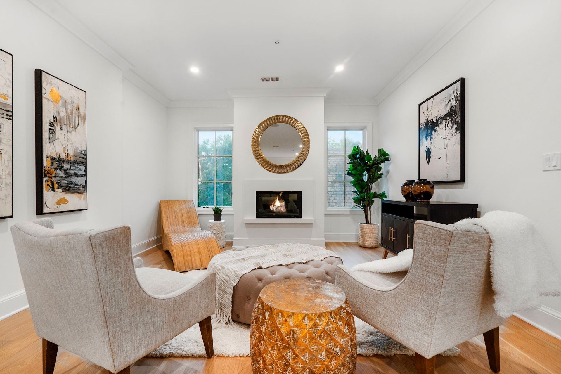 There is a fireplace in the middle of the living room.