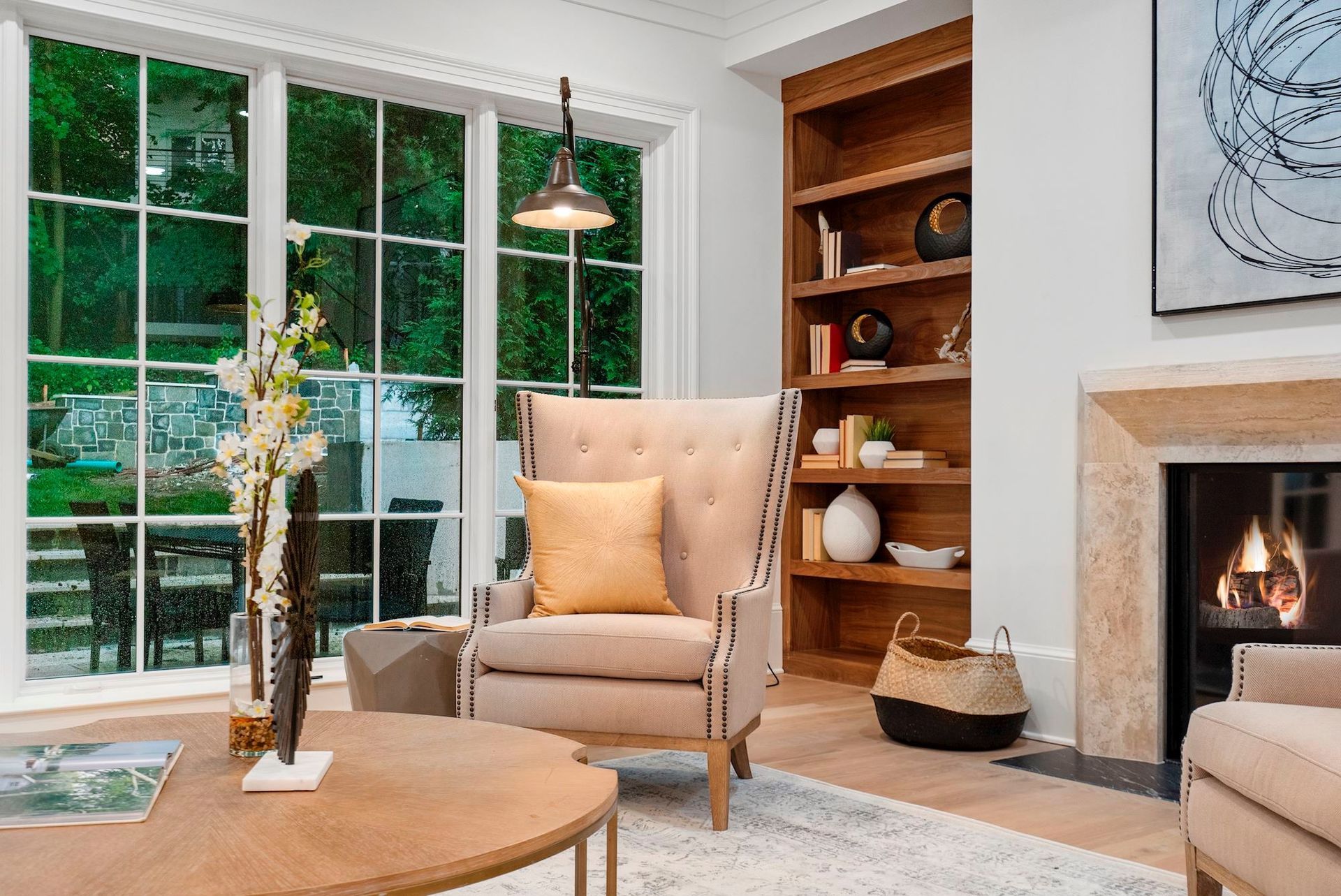 A living room with a fireplace and a chair