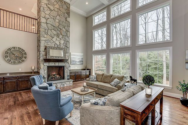 A living room filled with furniture and a fireplace.
