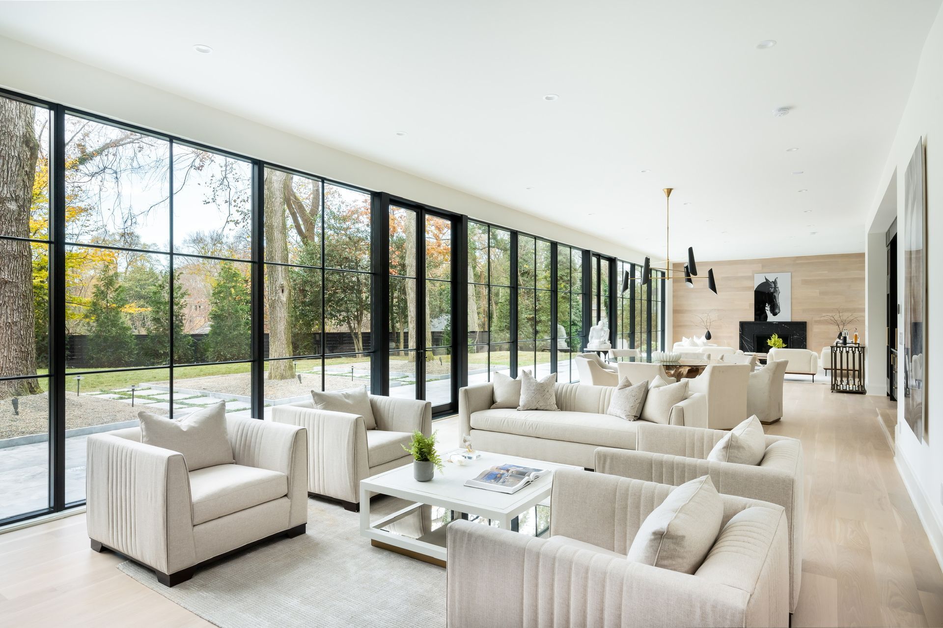 A living room filled with furniture and lots of windows.