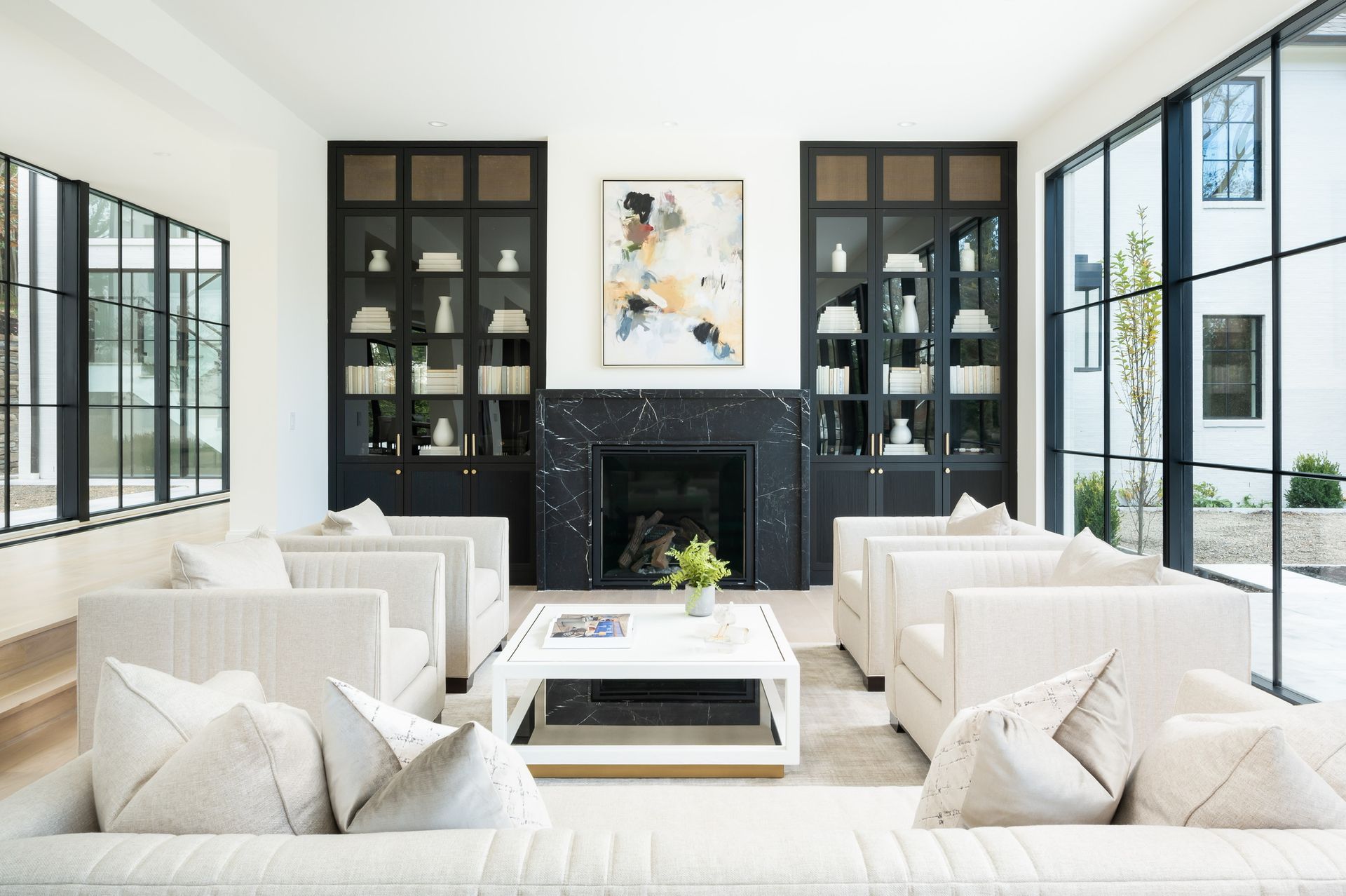 A living room filled with furniture and a fireplace.