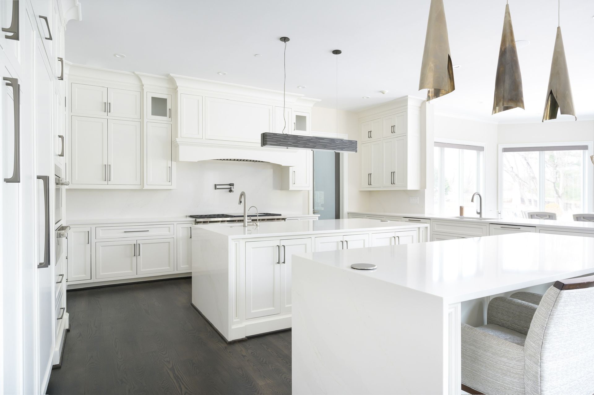 There is a large island in the middle of the kitchen.