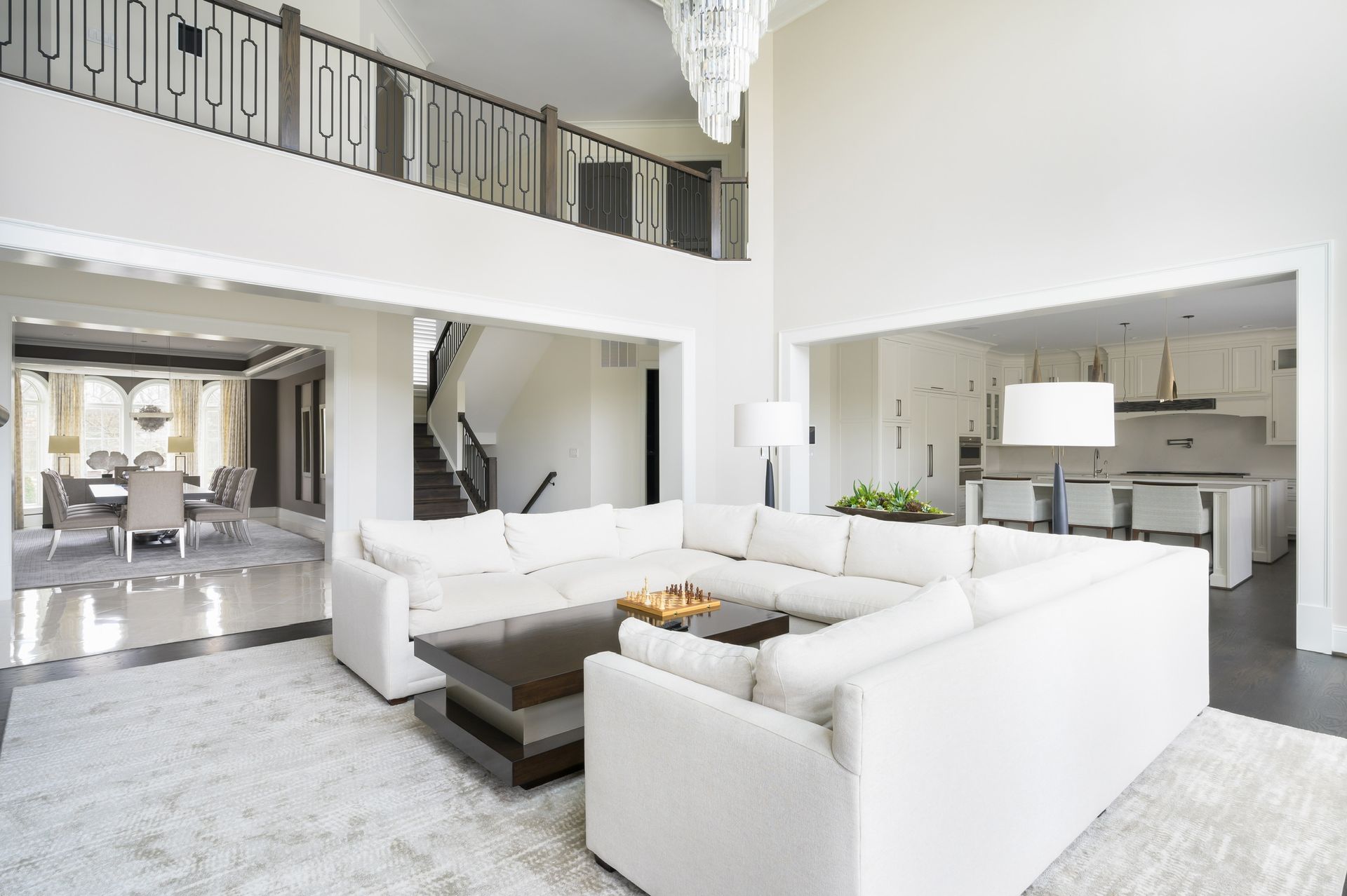 A living room with a large sectional couch and a coffee table