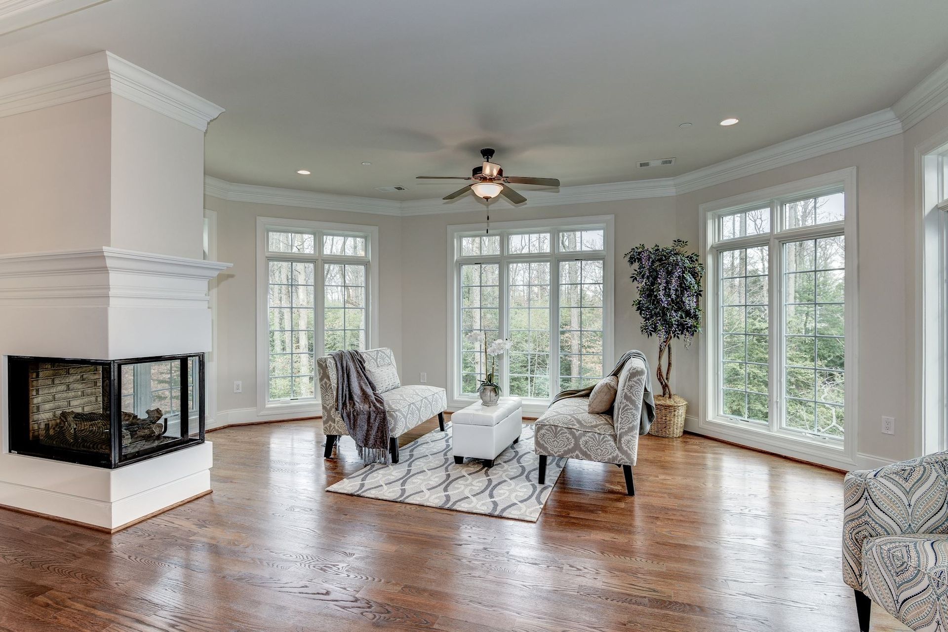 There is a fireplace in the middle of the living room.