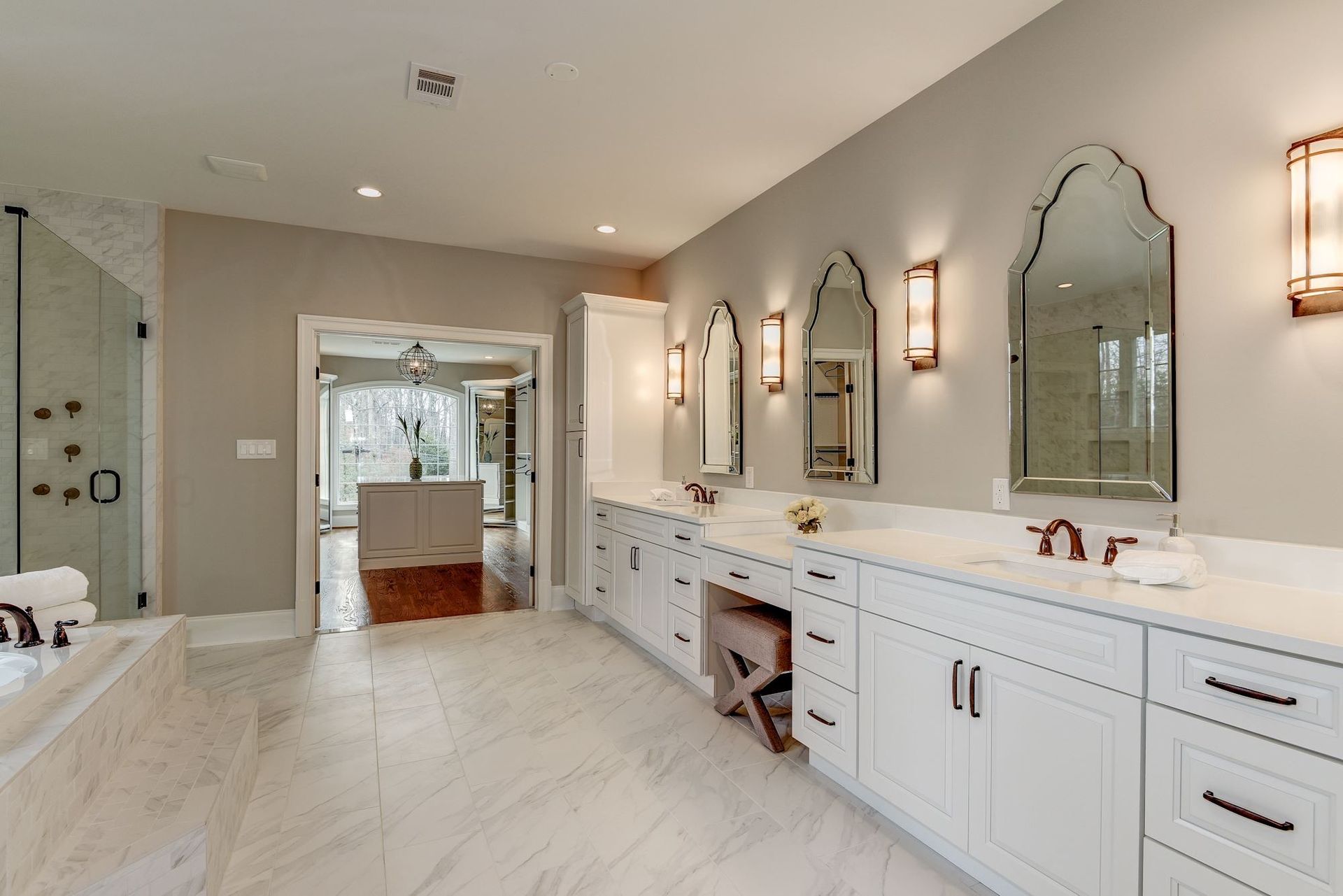 A bathroom with a lot of cabinets and mirrors