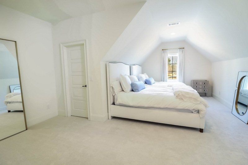 There is a large bed in the middle of the room.