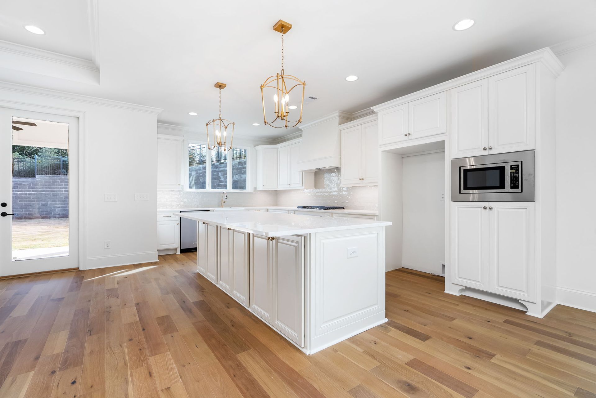 There is a large island in the middle of the kitchen.