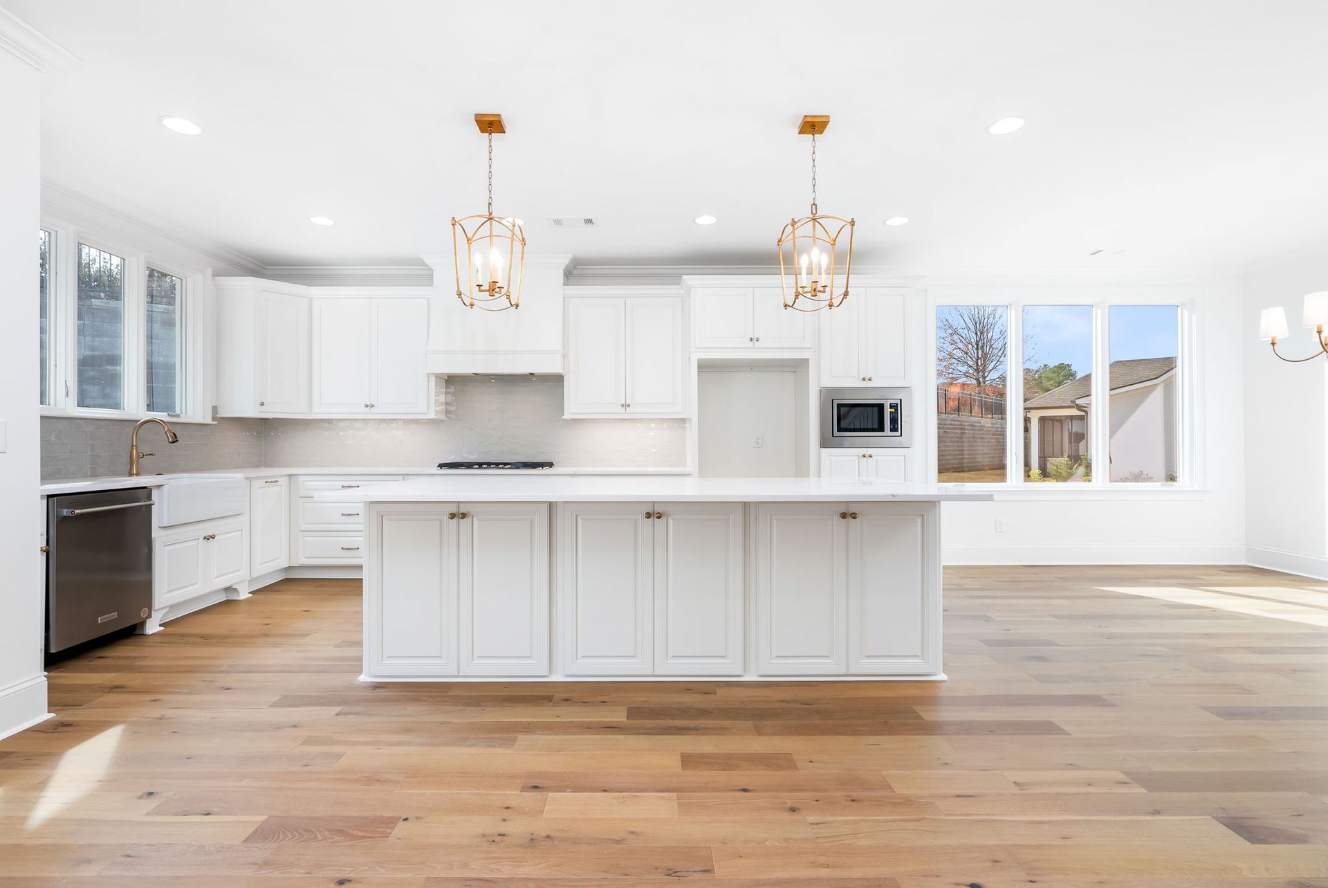 There is a large island in the middle of the kitchen.