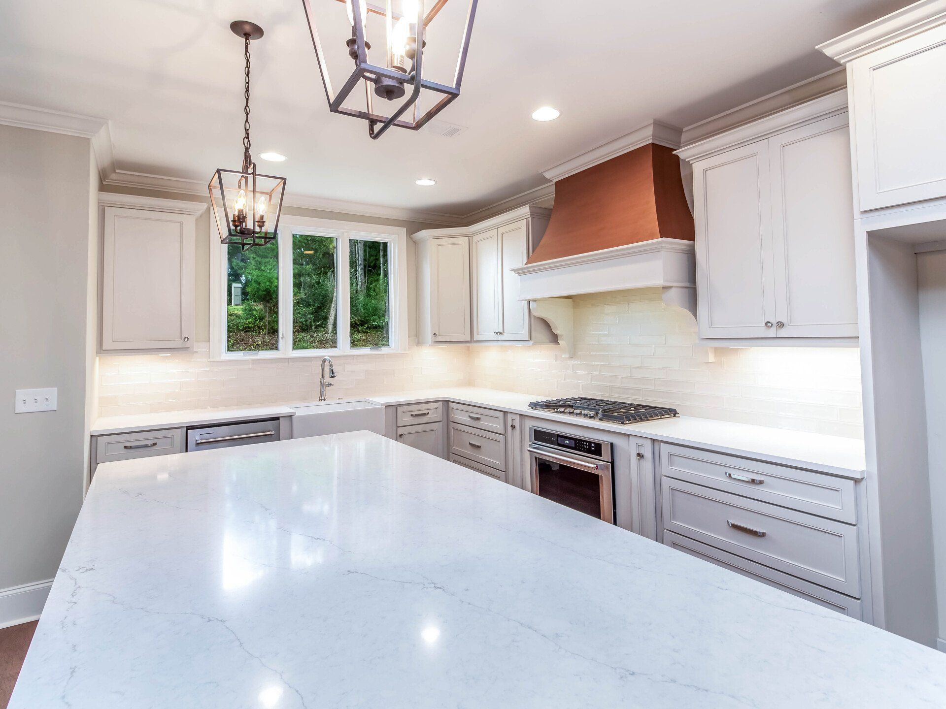 There is a large island in the middle of the kitchen.