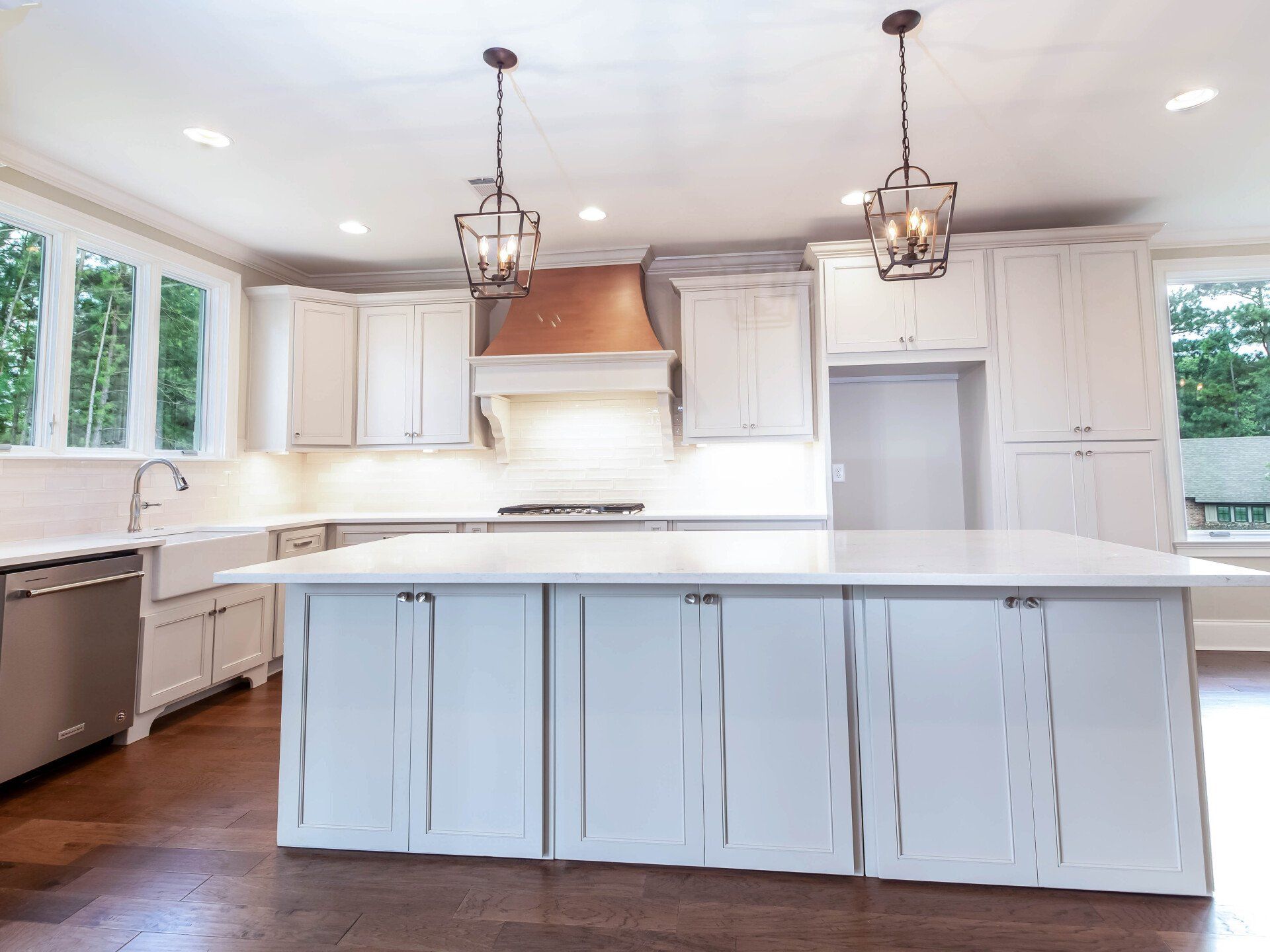 There is a large island in the middle of the kitchen.