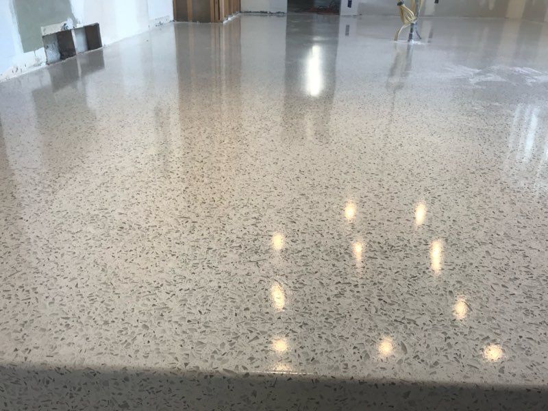 A close up of a shiny concrete floor in a room