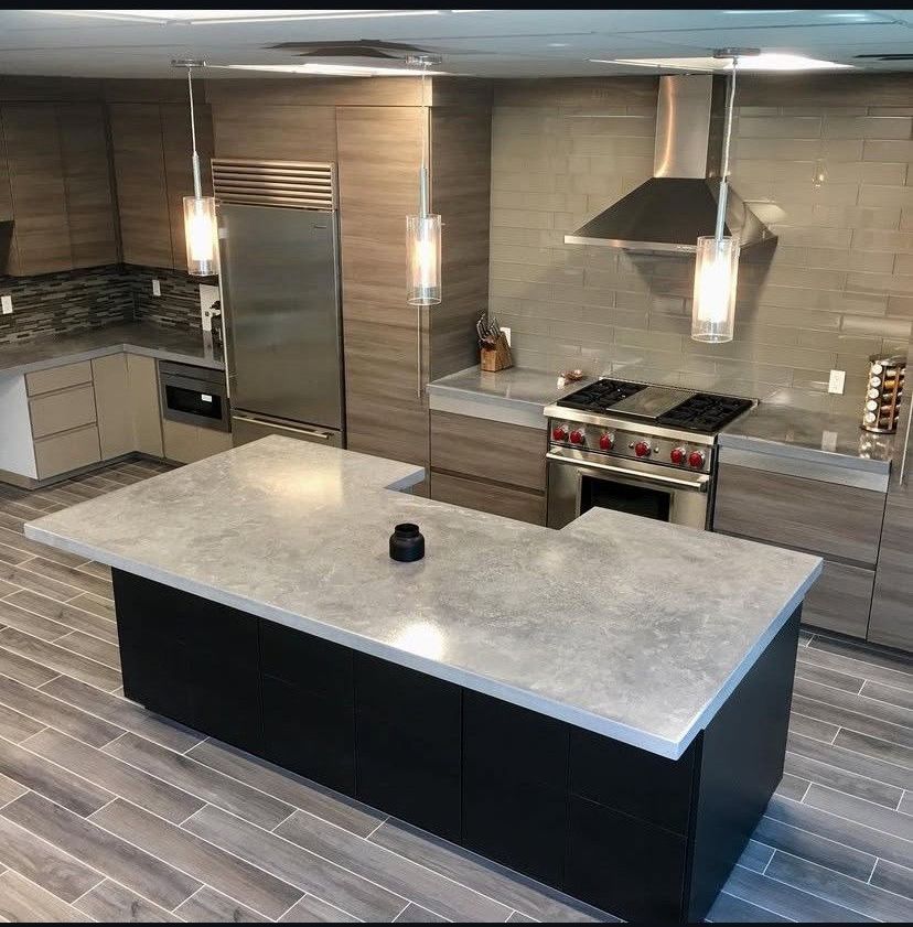 A bathroom with a sink , toilet , bathtub and mirror.