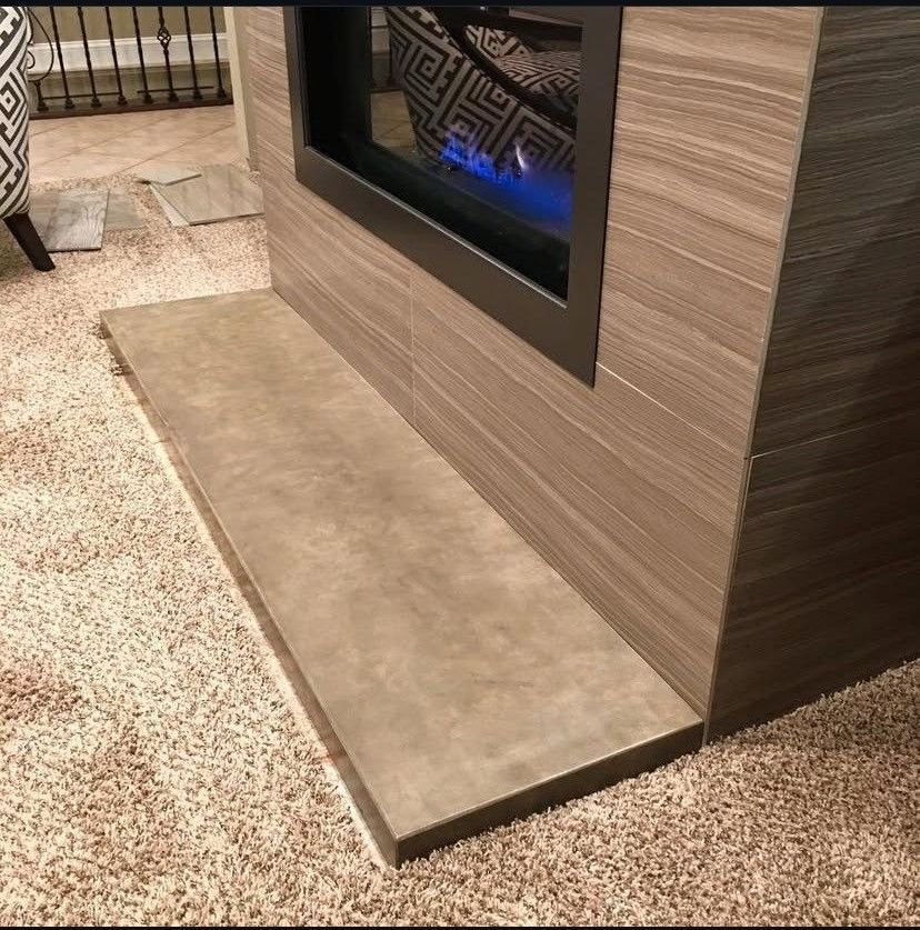 A close up of a marble floor with lights on it.