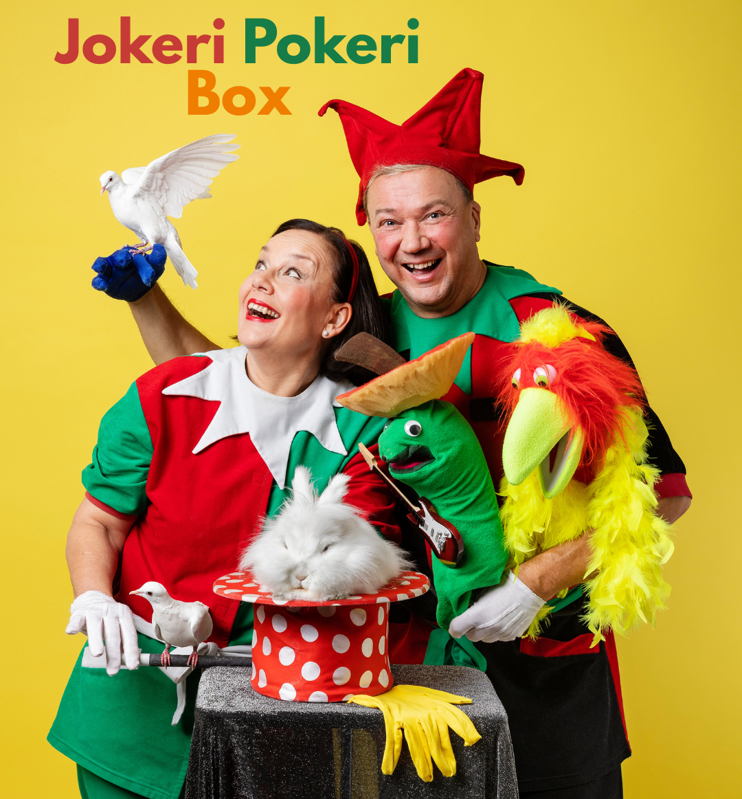 A brightly dressed magician duo against a yellow background, performing with a rabbit, two doves, and two hand puppets.
