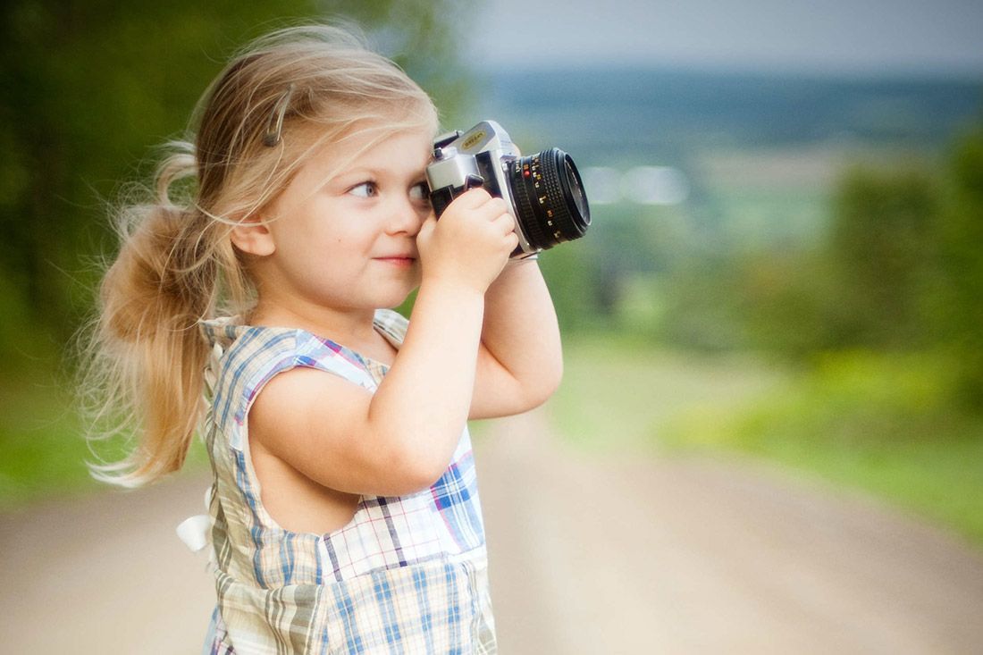 Little Girl Taking a Picture - Autism + Support