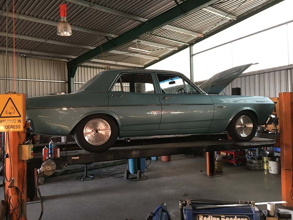 Blue car sideview — Wodonga Exhaust Centre in Wodonga, VIC