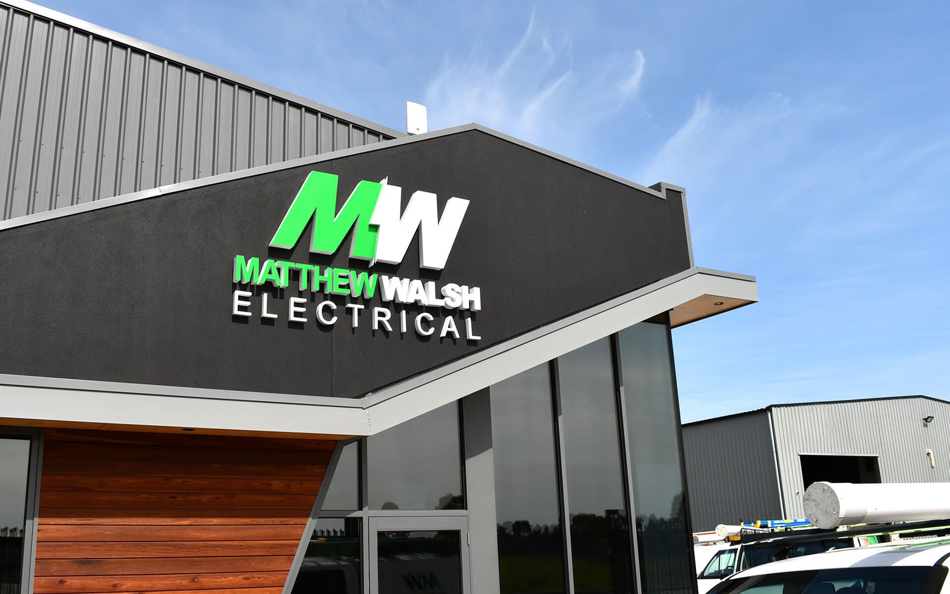 A building with a sign that says matthew walsh electrical on it.