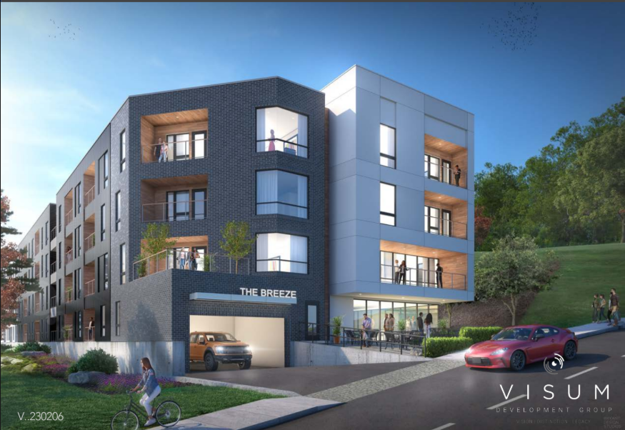 Modern apartment building with dark gray and white facade; car parked in the garage, red car on the street, and a person walking.