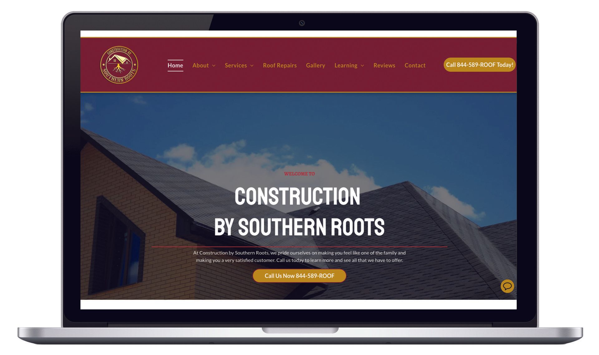 A laptop screen shows a website for construction by southern roots