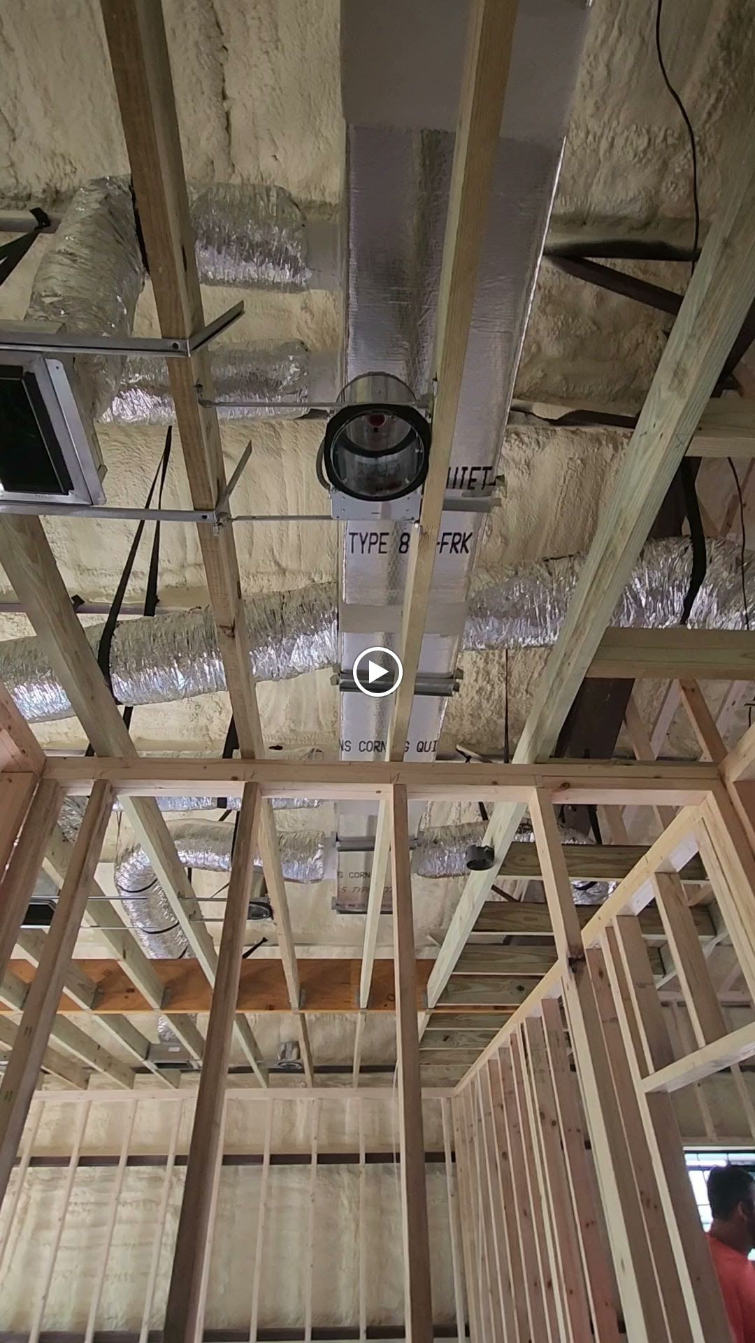 Framed interior construction with ductwork in the ceiling.