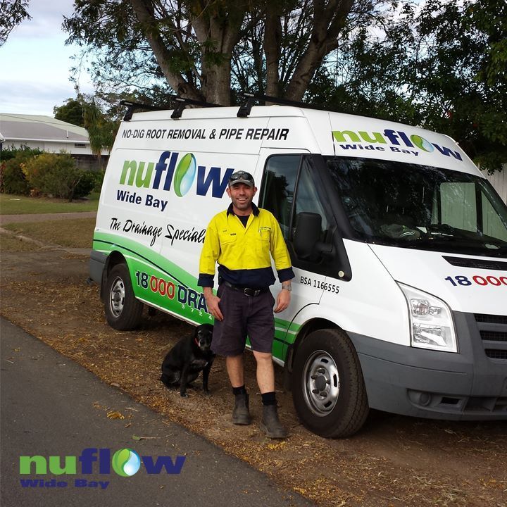 A Man Standing Beside a White Van — Nuflow Wide Bay in Bundaberg South, QLD