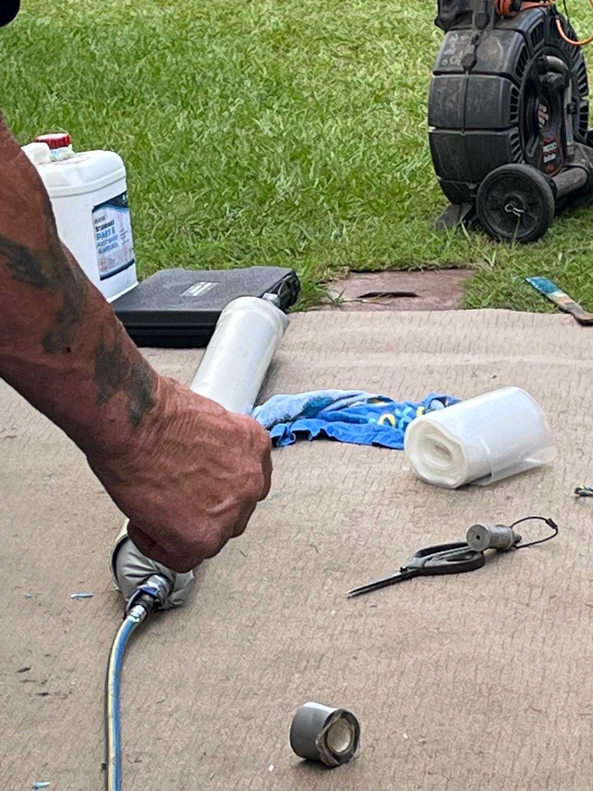 A Man Working with Drain Cleaning Equipment — Nuflow Wide Bay in Woodgate, QLD