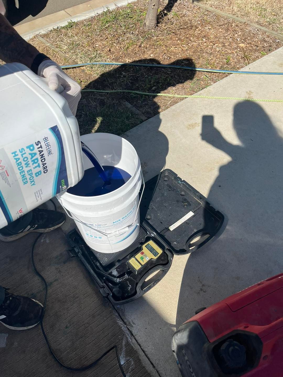 A Person Pours a Liquid from A Container — Nuflow Wide Bay in Bundaberg South, QLD