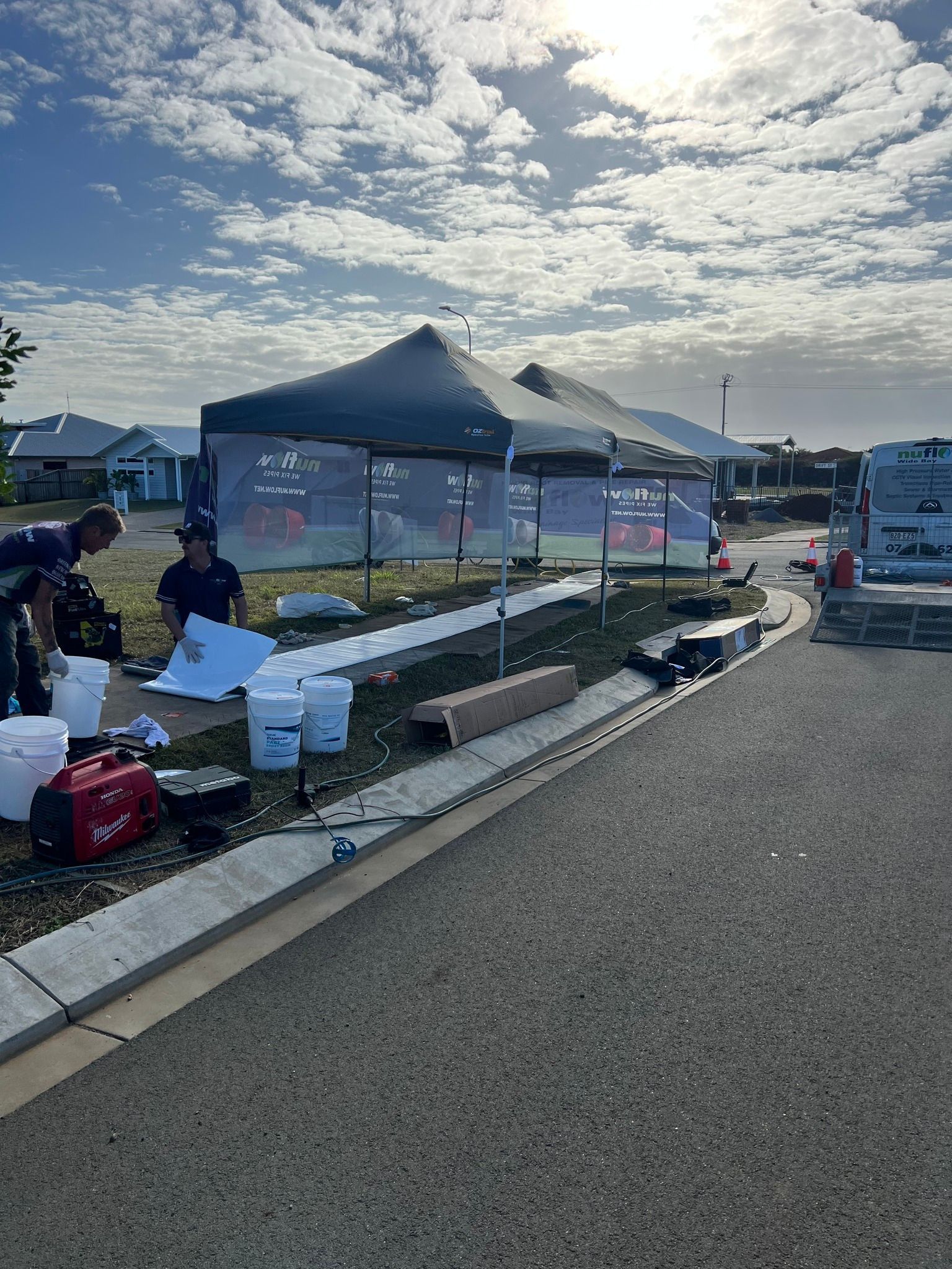 People Setting up Canopies Outdoors on A Sunny Day — Nuflow Wide Bay in South Kolan, QLD