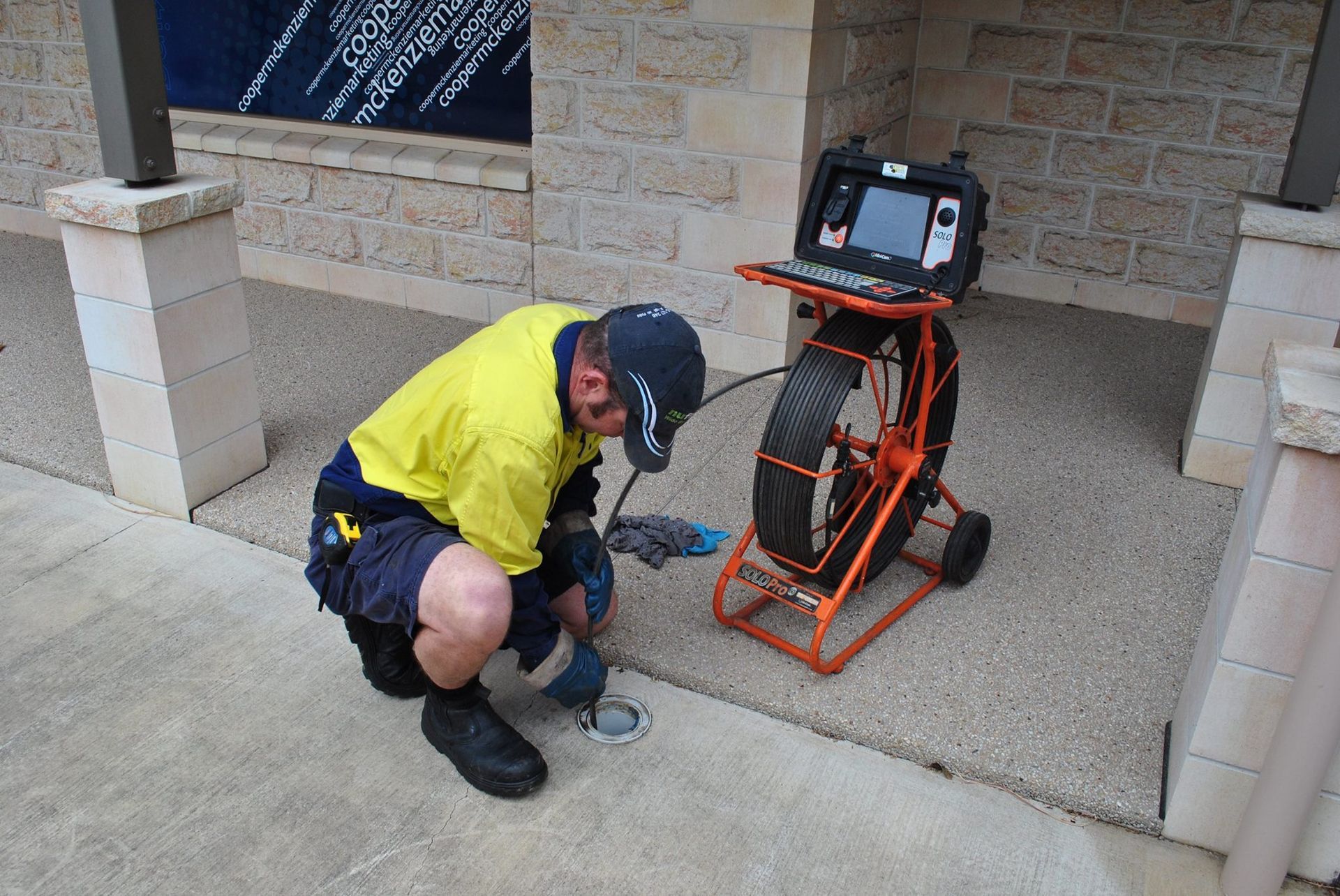 A Man Inspecting a Drain with A Camera — Nuflow Wide Bay in Woodgate, QLD