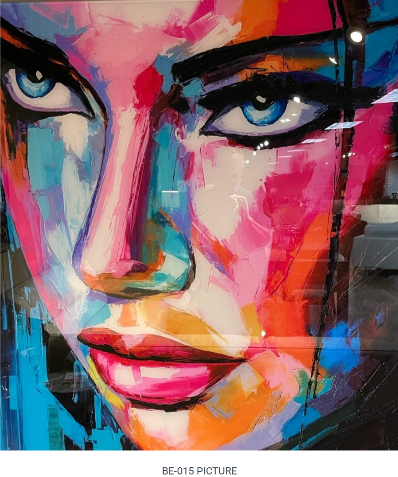 Close-up of a colorful abstract portrait. Woman's face with bright blue eyes, pink lips, and strokes of orange, pink, and blue paint.