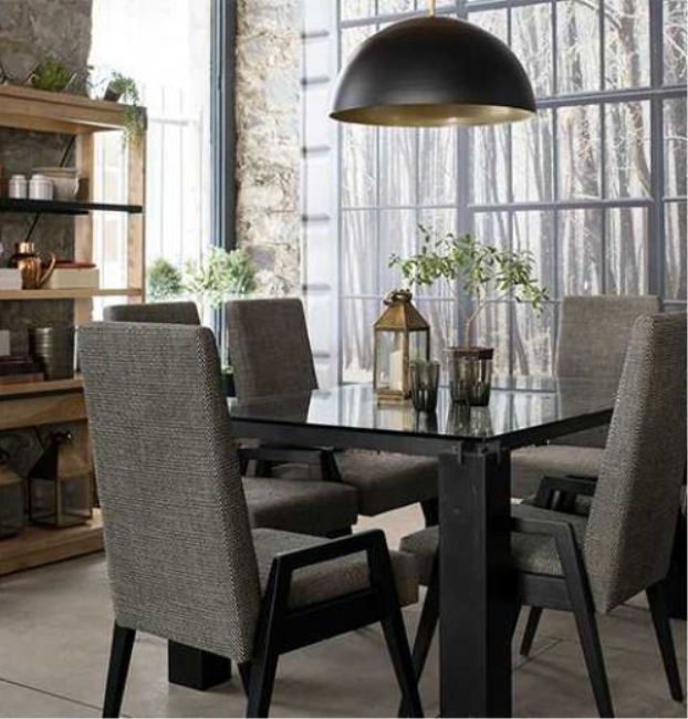 Dining room: table with six chairs, a hanging black light, and a wooden shelf.