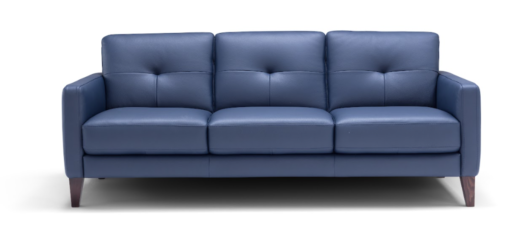 Blue three-seater sofa with wooden legs and button-tufted backrests, set against a white background.