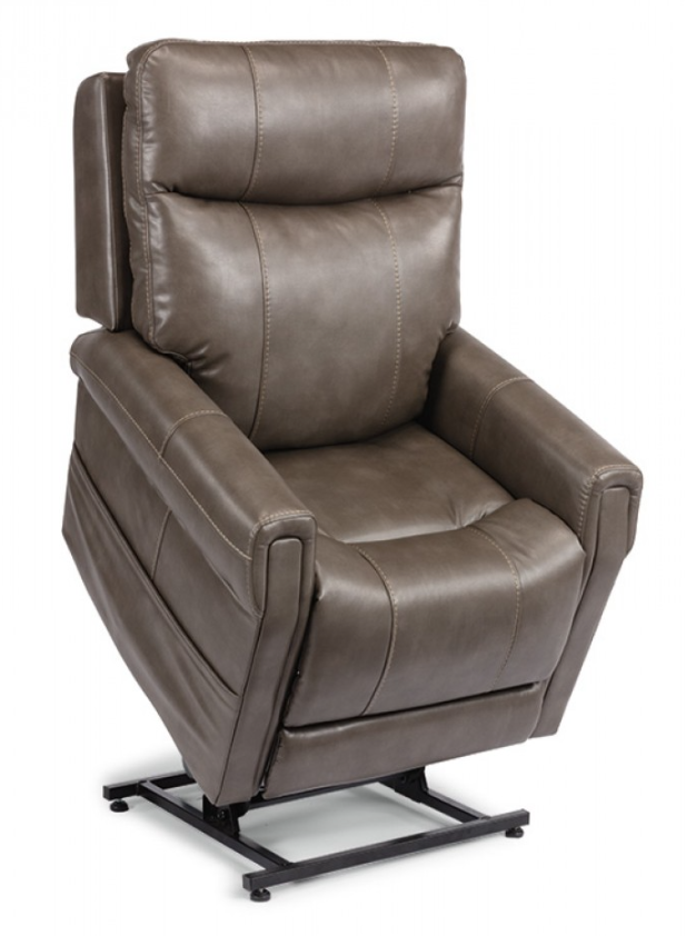 Brown leather lift chair reclined with footrest extended.