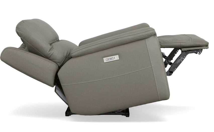 Gray leather recliner chair, footrest extended.