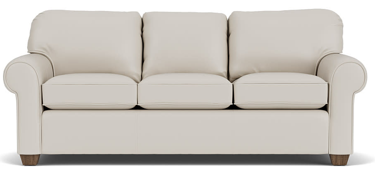 Cream-colored three-cushion sofa with rolled arms, wooden feet.