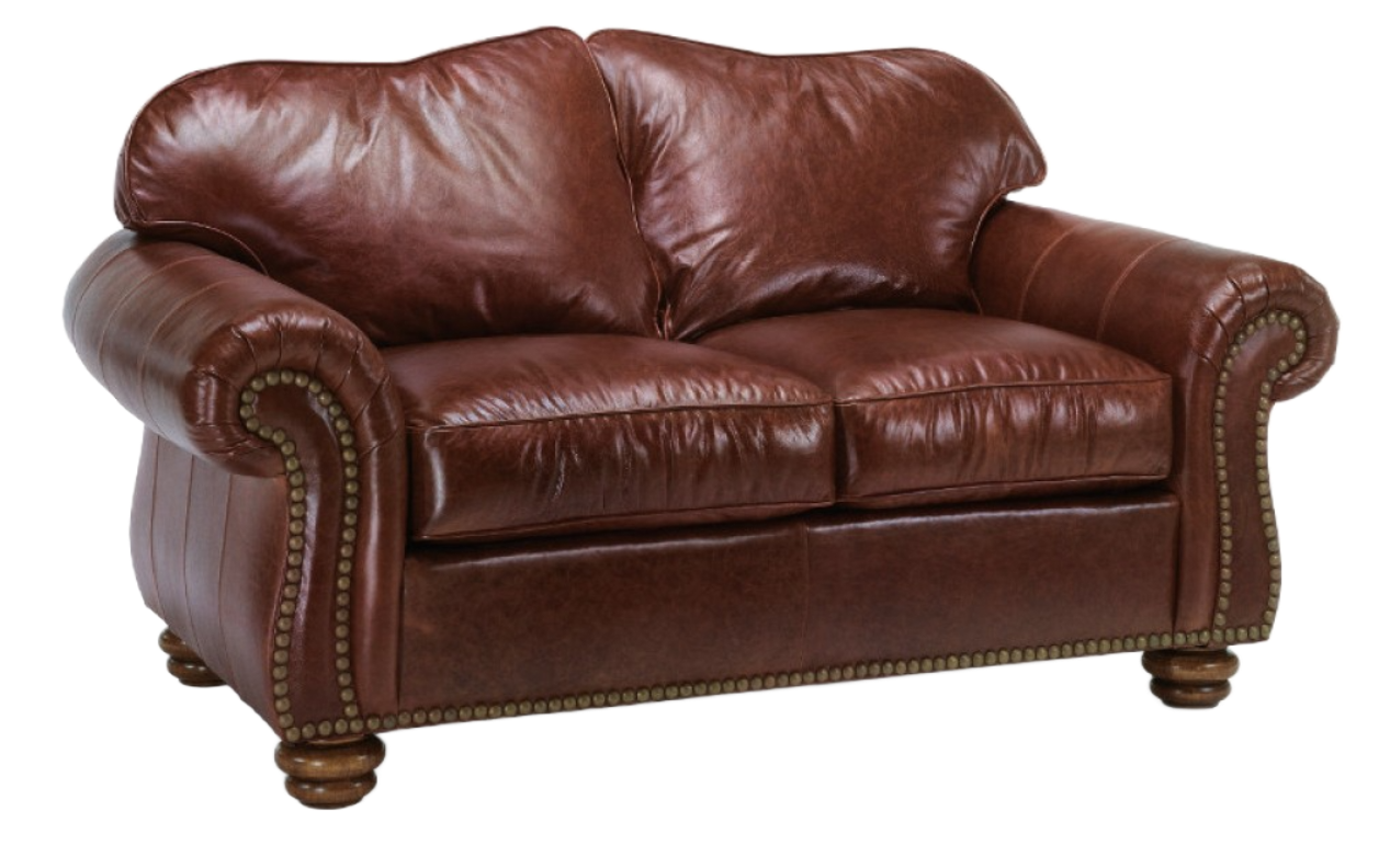 Brown leather armchair and ottoman with nailhead trim and wooden feet.