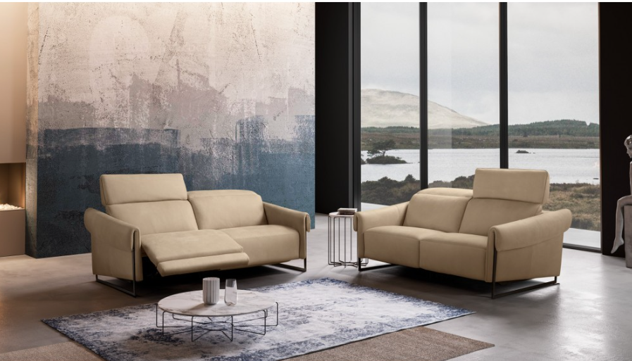 Yellow modern sofa with adjustable headrest, metal legs, against a white background.