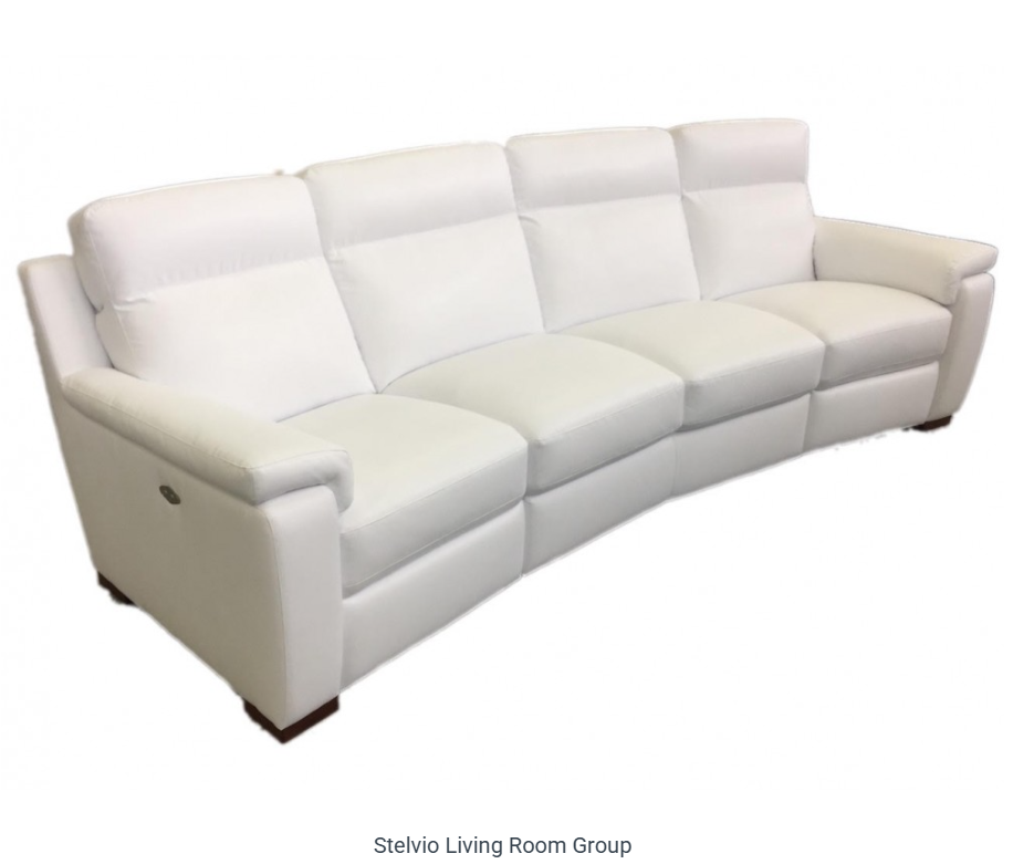 White, curved leather sofa with four reclining seats.