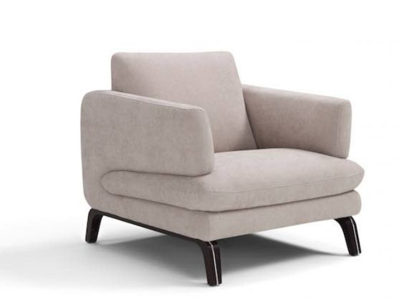 Beige upholstered armchair with curved arms, on dark wooden legs.