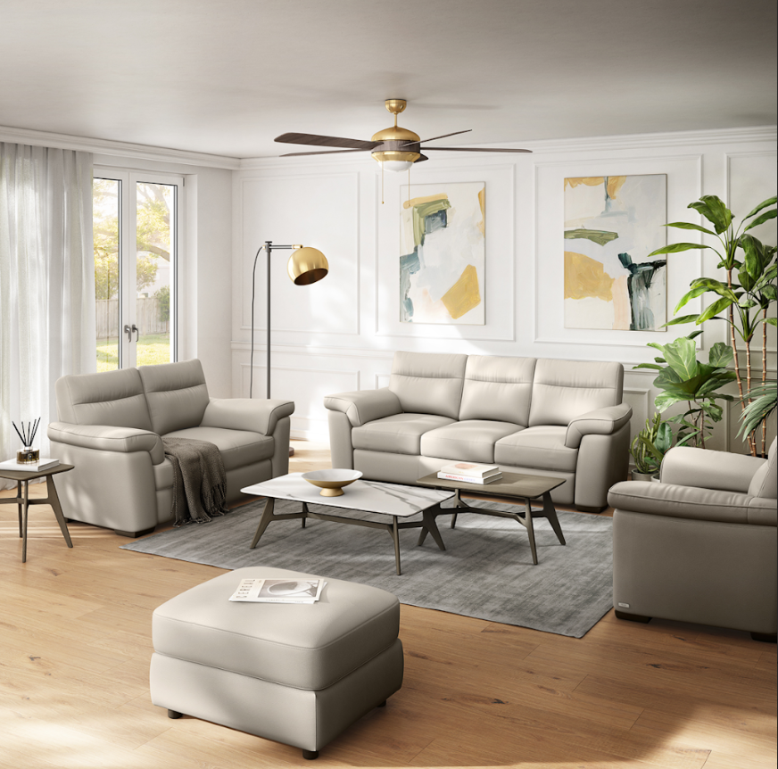 Beige leather recliner with headrest and footrest extended.