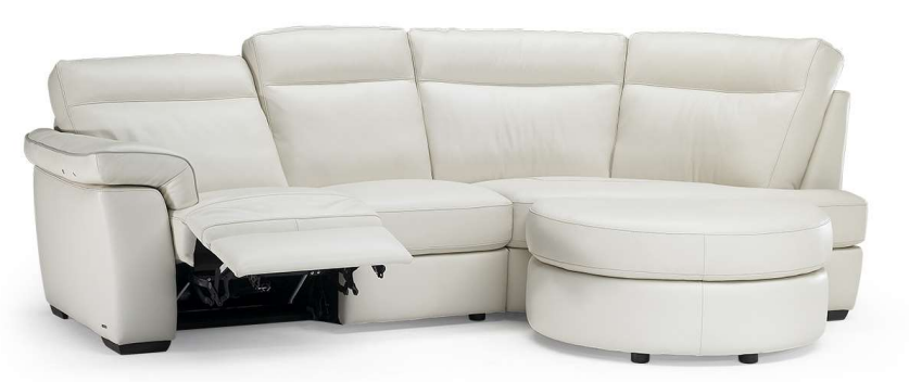 White leather sectional sofa with reclined footrest and curved ottoman.