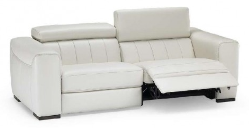 White leather reclining loveseat with adjustable headrests, one seat reclined, in a neutral setting.