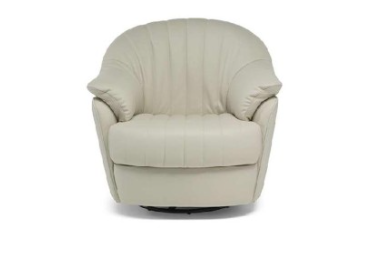 Navy blue velvet swivel armchair with pillow.